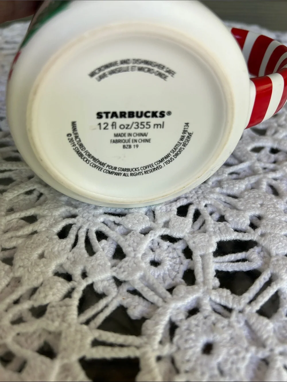 Starbucks White Mug with Green Leaf Motif and Red-White Striped Handle